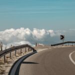 road sign arrow clouds sky 8410533